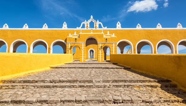 Path leading to the entrance of the colonial monastery in Izamal, Mexico.
