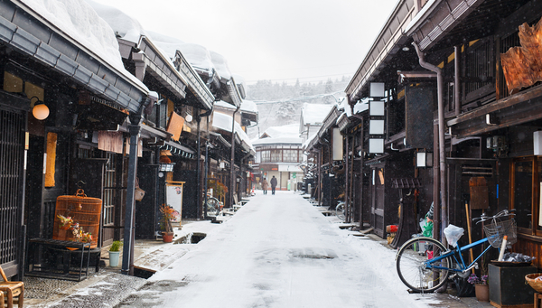 Wooden houses in the historic town of Takayama in Japan on winter day.
