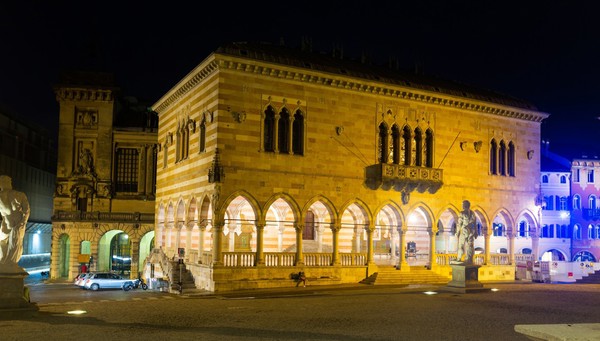 A night-time view of Udine’s main square, Piazza Libertà, with the town hall illuminated
