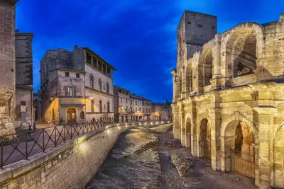 The remarkable Roman amphitheatre at sunset in Arles.