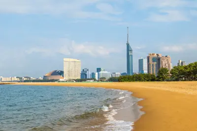 Fukuoka skyline with Fukuoka Tower next to the beach in Kyushu